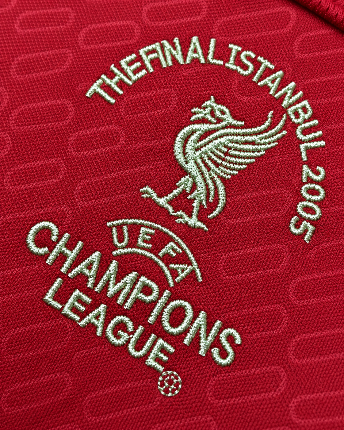 Close-up of Liverpool Istanbul 2005 Champions League Final chest embroidery on the 2004/05 home shirt